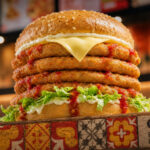 Oporto has launched a new Big Papa Bondi Burger for $18, taking its signature chicken burger and stacking it with four fresh-grilled chicken breast...