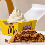   McDonald’s Australia is testing a pair of indulgent new desserts, with Loaded Choc Chip Cookies appearing at selected restaurants. Customers can choose between...